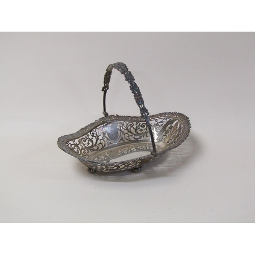 147 - An early 20c, 19c style, silver fruit basket of quatrefoil form with pierced raised border and cast ... 