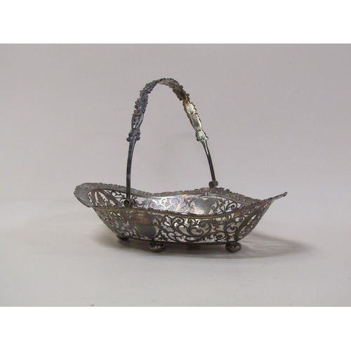 147 - An early 20c, 19c style, silver fruit basket of quatrefoil form with pierced raised border and cast ... 