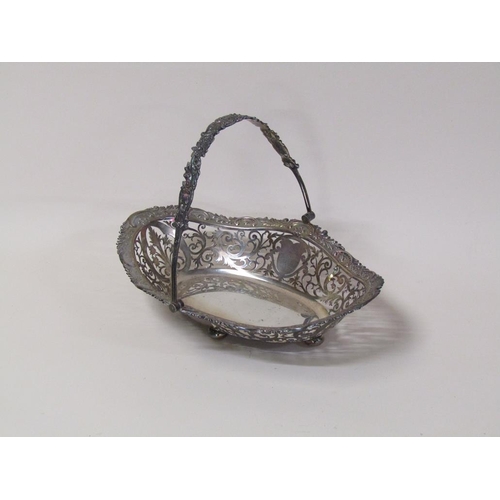 147 - An early 20c, 19c style, silver fruit basket of quatrefoil form with pierced raised border and cast ... 