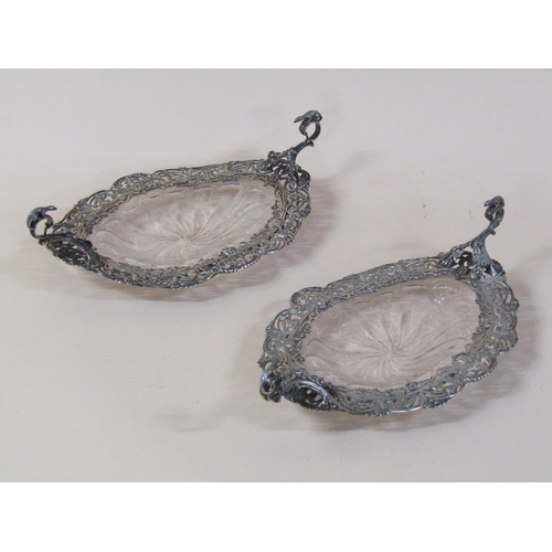 148 - A pair of William Comyns sweatmeat dishes with moulded and cut glass bases surrounded by pierced sil... 