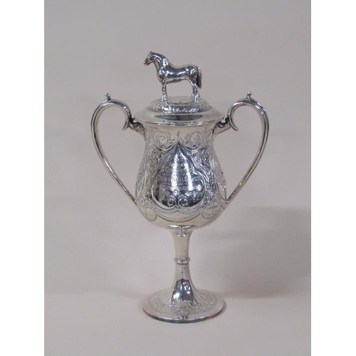 149 - A late Victorian two handled silver trophy cup, awarded for the best foal in show 1889, with lift of... 