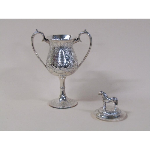 149 - A late Victorian two handled silver trophy cup, awarded for the best foal in show 1889, with lift of... 