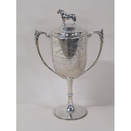 150 - A late Victorian silver two handled trophy cup with lift off cover having standing horse finial, bei... 