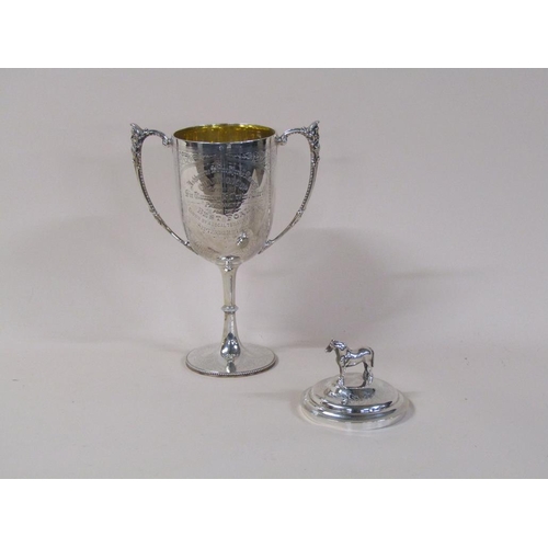 150 - A late Victorian silver two handled trophy cup with lift off cover having standing horse finial, bei... 