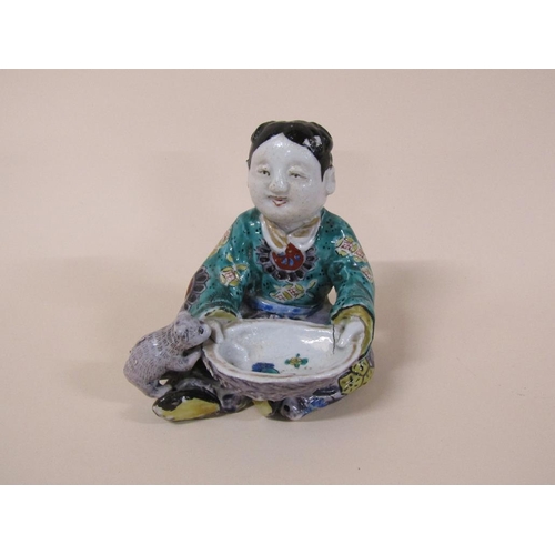 174 - An Oriental polychrome figure of a boy with bowl feeding a dog, a/f to dogs tail, 13cm h.