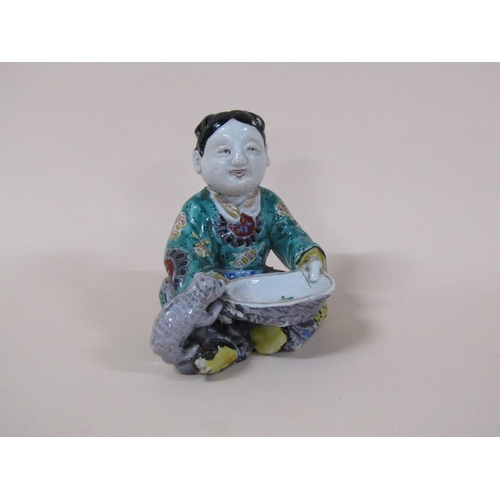 174 - An Oriental polychrome figure of a boy with bowl feeding a dog, a/f to dogs tail, 13cm h.