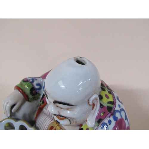 175 - A 19c Chinese porcelain figurative incense burner in the form of Hotei, 17cm h.