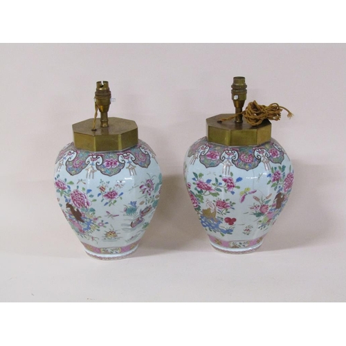 176 - A pair famille rose style porcelain lamps converted from jars, decorated with birds, flowers, insect... 