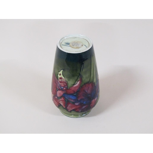 192 - A mid 20c Moorcroft Orchid vase of slight baluster form, decorated on a green ground, painted and im... 