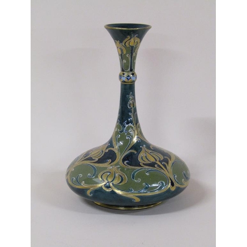 195 - A Macintyre Moorcroft Florian vase of baluster form with slender tapering neck, with stylised poppy ... 