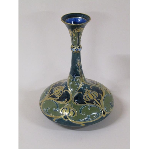 195 - A Macintyre Moorcroft Florian vase of baluster form with slender tapering neck, with stylised poppy ... 