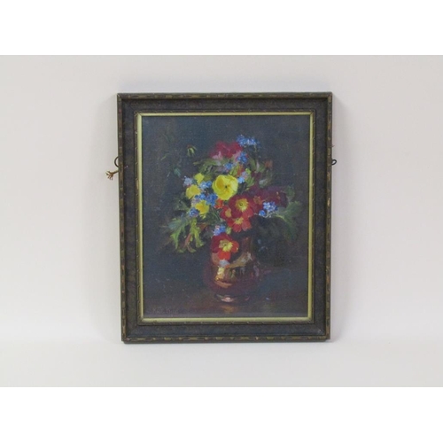 243 - Kate Wylie - A vase of spring flowers, signed, oil on  canvas on board, framed, 27cm x 22cm.