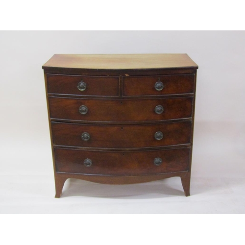 249 - A late Georgian mahogany bow front chest of two short and three long graduated drawers on splayed br... 