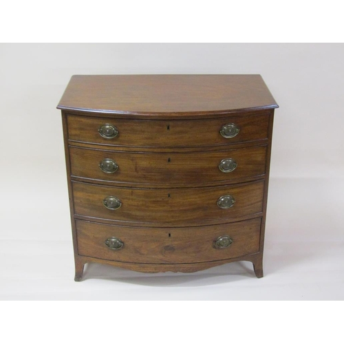 261 - A late Georgian mahogany bow front chest of four long graduated drawers with shaped apron and splaye... 