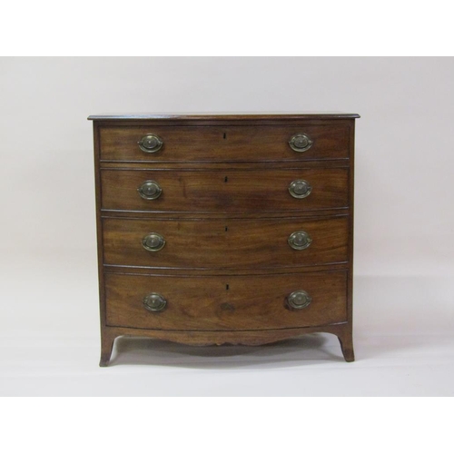 261 - A late Georgian mahogany bow front chest of four long graduated drawers with shaped apron and splaye... 