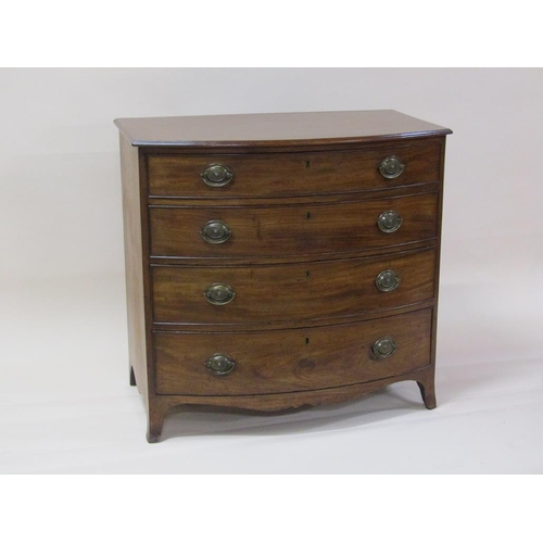 261 - A late Georgian mahogany bow front chest of four long graduated drawers with shaped apron and splaye... 