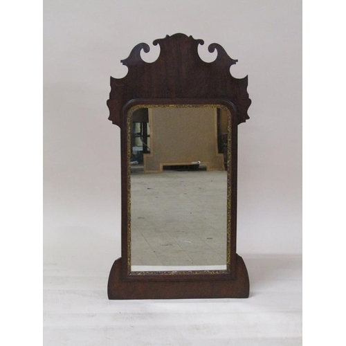 263 - A late Georgian mahogany fret cut wall mirror, the mirror with parcel gilt moulded surround, 89cm x ... 