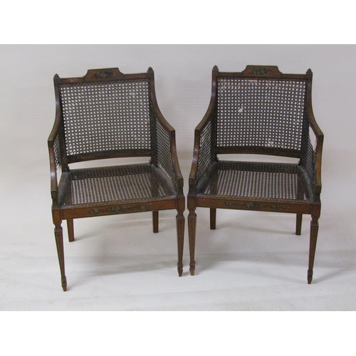 273 - A pair of Regency period painted and caned armchairs with rear swept legs and straight square taperi... 