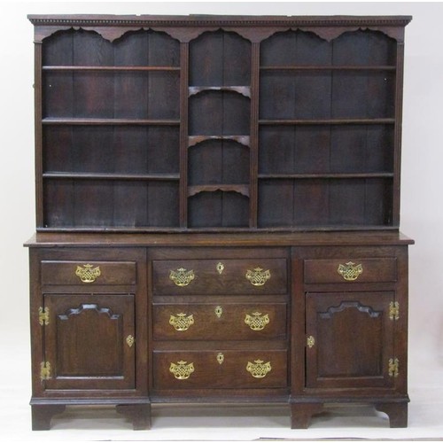 267 - A late 18c English oak dresser with rack, fitted three central drawers flanked by two short drawers ... 