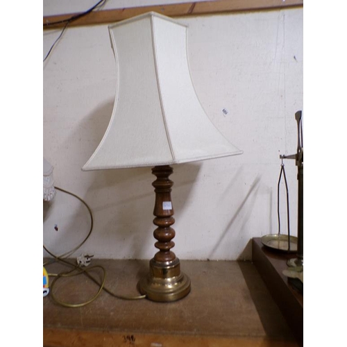 31 - WOODEN TABLE LIGHT WITH BRASS MOUNTS AND SHADE