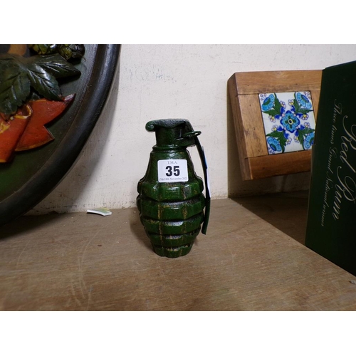 35 - REPRODUCTION CAST IRON GRENADE COIN BANK