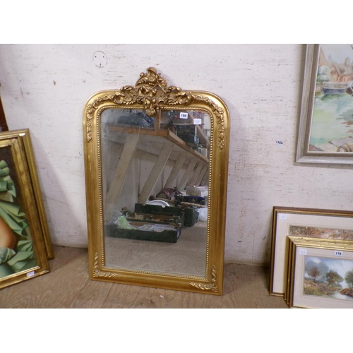 180 - GILT FRAMED WALL MIRROR WITH A CHERUB MOUNT