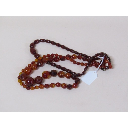 1525 - TWO STRINGS OF AMBER LIKE BEADS