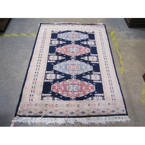 2012 - ORIENTAL WOOLLEN RUG OF BLACK FAUN PATTERN GROUND, 127CM X 192CM