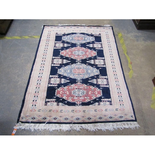 2012 - ORIENTAL WOOLLEN RUG OF BLACK FAUN PATTERN GROUND, 127CM X 192CM