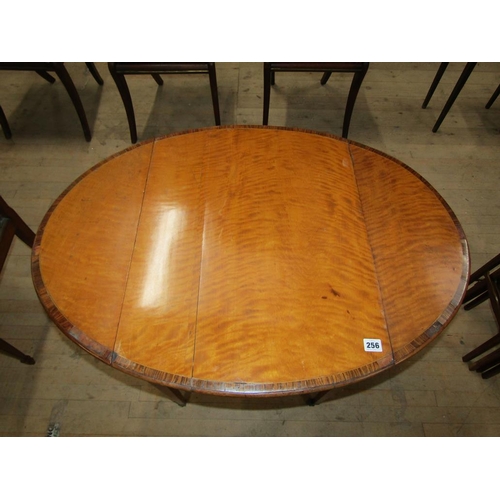 256 - A Regency period satinwood oval Pembroke type table, crossbanded and line inlaid, fitted one end dra... 