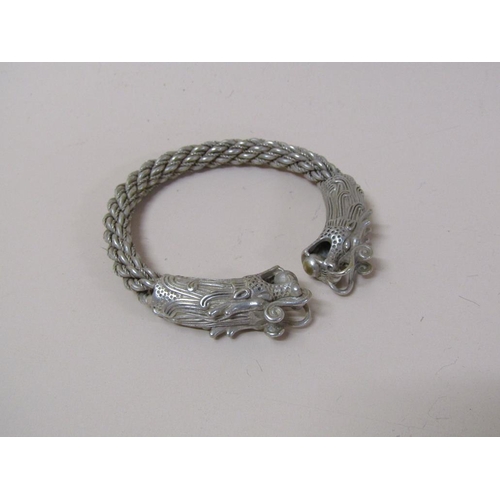 1517 - ORIENTAL WHITE METAL BANGLE IN THE FORM OF A DRAGON