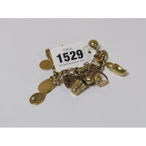 1529 - 9ct GOLD CHARM BRACELET - APPX 17 GOLD CHARMS, TOTAL WEIGHT 31.1g