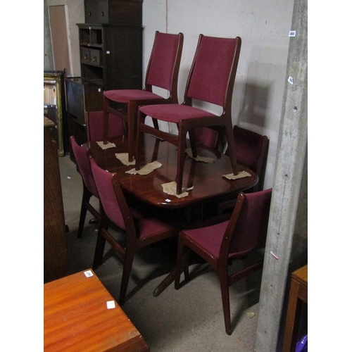 694 - TEAK EXTENDING DINING TABLE AND EIGHT CHAIRS