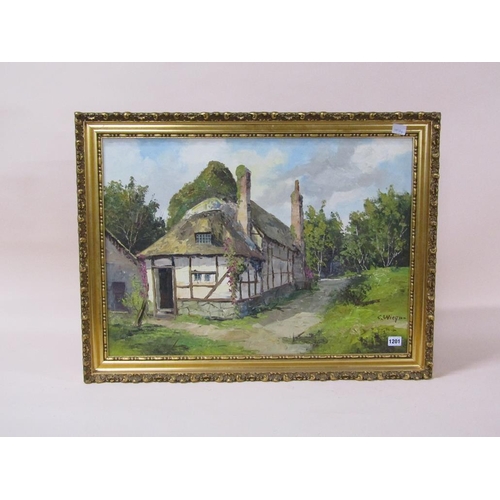 1201 - C WIEGNAM - TIMBERED COTTAGE, SIGNED OIL ON CANVAS, FRAMED, 50CM X 69CM