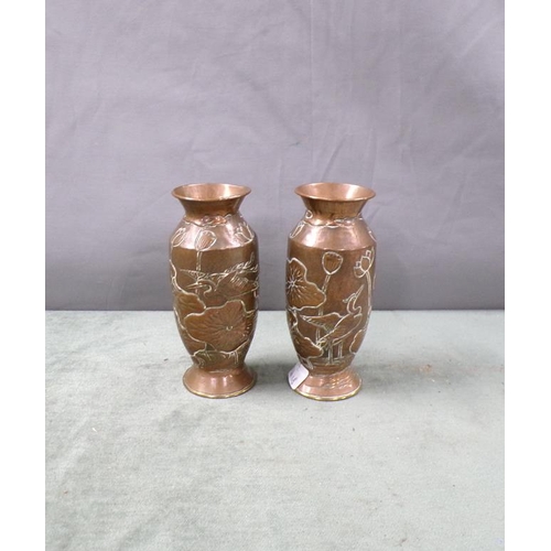 1355 - PAIR OF ORIENTAL EMBOSSED AND CHASED COPPERED BALUSTER VASES, 12cms H