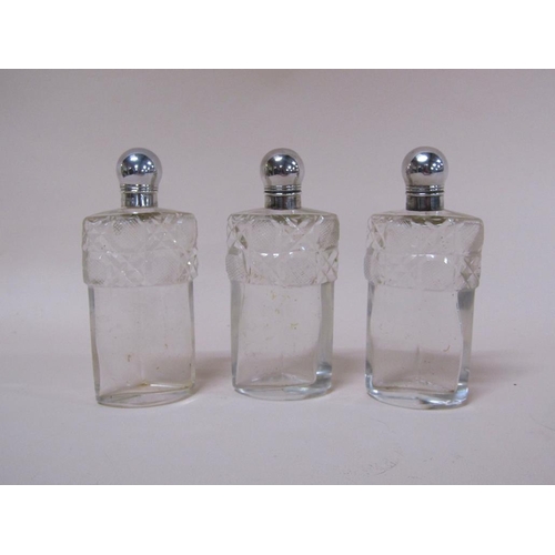 1735A - PIERCED SILVER AND CUT GLASS THREE BOTTLE CLUSTER SCENT BOTTLES BY JOHN GRINSELL & SONS, BIRMINGHAM ... 