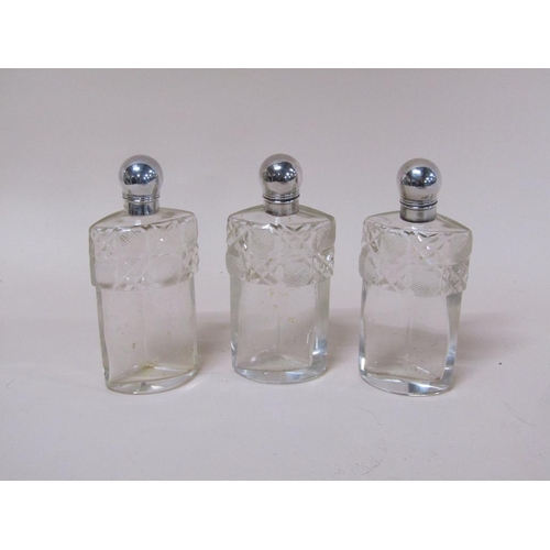 1735A - PIERCED SILVER AND CUT GLASS THREE BOTTLE CLUSTER SCENT BOTTLES BY JOHN GRINSELL & SONS, BIRMINGHAM ... 