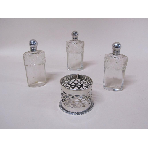 1735A - PIERCED SILVER AND CUT GLASS THREE BOTTLE CLUSTER SCENT BOTTLES BY JOHN GRINSELL & SONS, BIRMINGHAM ... 