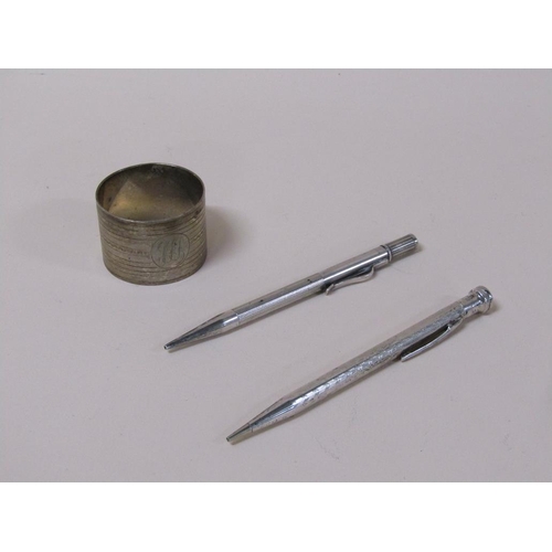 1710 - TWO SILVER PROPELLING PENCILS AND A NAPKIN RING