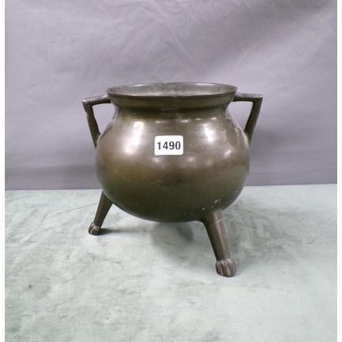 1490 - BRONZE TWO HANDLED COOKING POT ON THREE LEGS, 22CM H