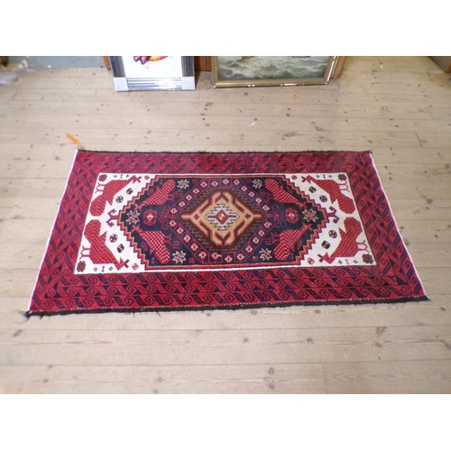 1939 - RED GROUND ORIENTAL RUG 94CM X 178