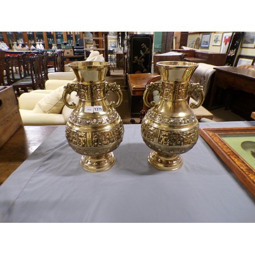 1375 - PAIR OF ORIENTAL BRASS TWO HANDLED BALUSTER VASES, EACH 42cms H