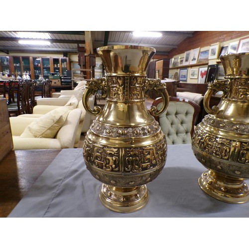 1375 - PAIR OF ORIENTAL BRASS TWO HANDLED BALUSTER VASES, EACH 42cms H