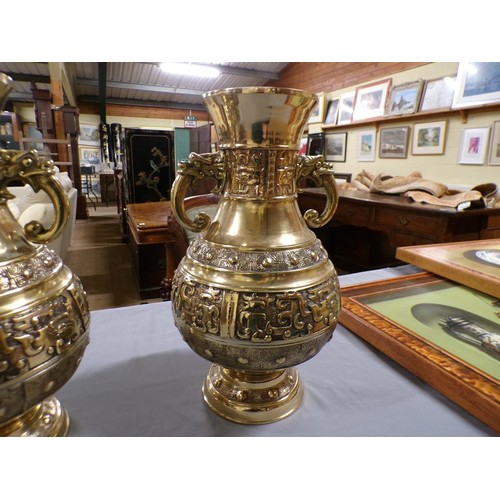 1375 - PAIR OF ORIENTAL BRASS TWO HANDLED BALUSTER VASES, EACH 42cms H