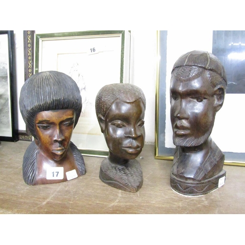 17 - THREE CARVED AFRICAN HEADS