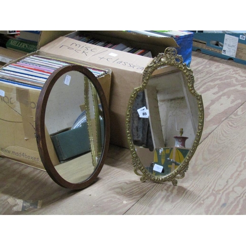 85 - GILT FRAMED WALL MIRROR; OVAL MIRROR