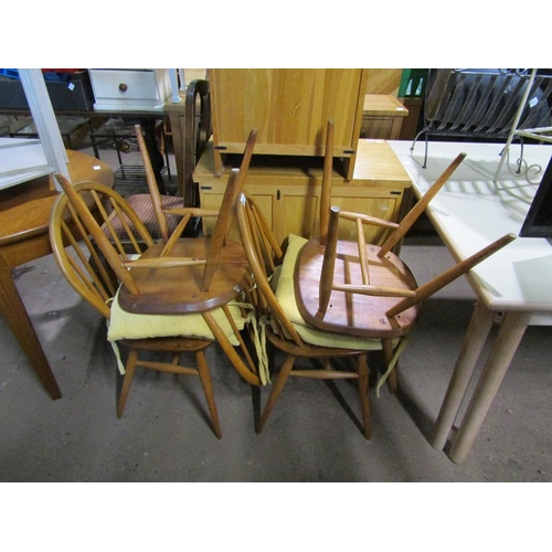 558 - FOUR ERCOL OAK DINING CHAIRS