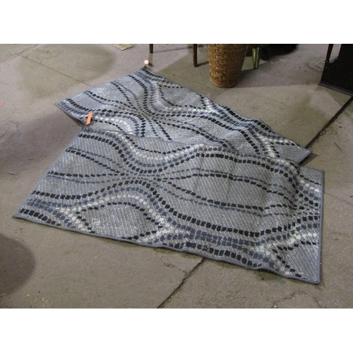 913 - TWO GREY GROUND RUGS