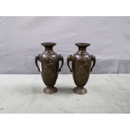 1499 - PAIR OF CAST ORIENTAL TWO HANDLED ELEPHANT HEAD VASES, 18CM H