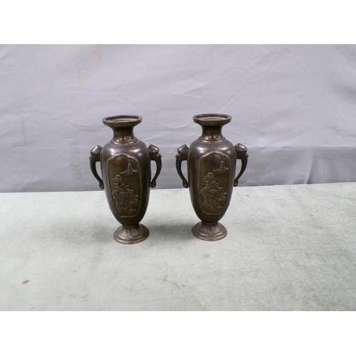 1499 - PAIR OF CAST ORIENTAL TWO HANDLED ELEPHANT HEAD VASES, 18CM H